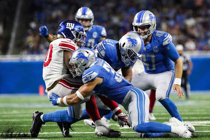 Detroit Lions safety Brady Breeze (35) tackles New York Giants punt returner Eric Gray (20) during the first half of a preseason at Ford Field in Detroit on Friday, Aug. 11, 2023.